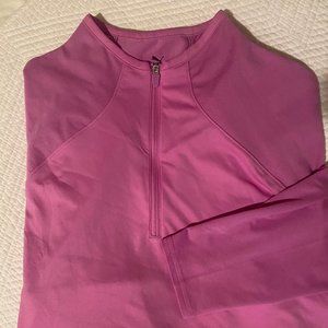 PUMA long sleeve athletic shirt with 1/4 zip front and shirt tail hem